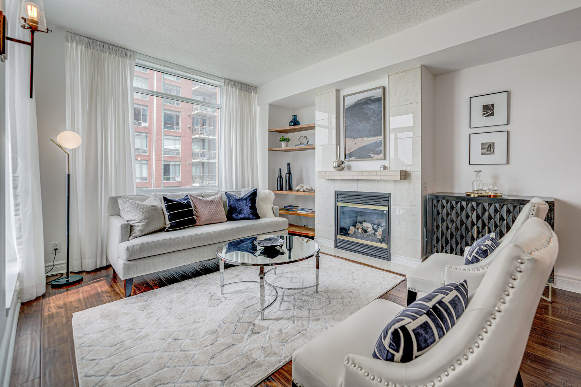 500 Queens Quay #503e view of living room and fireplace